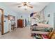 Spacious bedroom featuring bright blue walls and ceiling fan at 2820 Se 14Th St, Ocala, FL 34471
