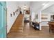Grand foyer with hardwood floors, a staircase, and a view into the living room at 2820 Se 14Th St, Ocala, FL 34471