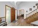 Welcoming foyer with hardwood floors, a staircase, and a bright, airy feel at 2820 Se 14Th St, Ocala, FL 34471