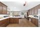 Spacious open kitchen featuring dark wood cabinets, stainless appliances, and white countertops at 2820 Se 14Th St, Ocala, FL 34471