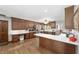 Well-lit kitchen featuring dark wood cabinetry, modern appliances, and ample counter space at 2820 Se 14Th St, Ocala, FL 34471