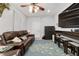 Comfortable living room featuring a leather sofa, entertainment center, and stylish fish-themed rug at 2820 Se 14Th St, Ocala, FL 34471