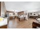 Open-concept living space connecting the kitchen and living room, with wood floors and modern decor at 2820 Se 14Th St, Ocala, FL 34471
