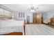 Spacious main bedroom featuring a bed, a ceiling fan, and natural light at 2820 Se 14Th St, Ocala, FL 34471