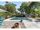 Relax by the sparkling pool surrounded by lush landscaping and comfortable lounge chairs at 2820 Se 14Th St, Ocala, FL 34471