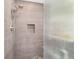 Modern shower with tiled walls, sleek fixtures, and a glass door at 2820 Se 14Th St, Ocala, FL 34471
