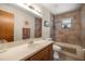 Well-lit bathroom with a vanity, and combined shower and bathtub combo and a window at 2981 Ne 39Th Pl, Ocala, FL 34479