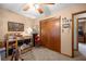 Bedroom with neutral walls and carpet, wood trim, and closet and ceiling fan at 2981 Ne 39Th Pl, Ocala, FL 34479