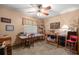 Cozy bedroom featuring a sewing area and comfortable decor and ceiling fan at 2981 Ne 39Th Pl, Ocala, FL 34479