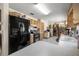 Traditional kitchen with modern black refrigerator and classic oak cabinets at 2981 Ne 39Th Pl, Ocala, FL 34479