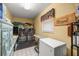Well-equipped laundry room with washer, dryer, sink and storage, and organization shelving at 2981 Ne 39Th Pl, Ocala, FL 34479