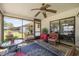 Inviting screened-in patio with view of backyard and comfortable seating arrangement at 2981 Ne 39Th Pl, Ocala, FL 34479