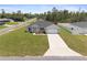 Aerial view of new construction home with lush front lawn and long driveway at 3079 Sw 168 Pl, Ocala, FL 34473