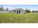 Home exterior with a large, well-maintained backyard, perfect for outdoor activities at 3079 Sw 168 Pl, Ocala, FL 34473