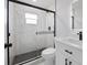 Modern bathroom features a glass-enclosed shower with black fixtures and a sleek vanity at 3079 Sw 168 Pl, Ocala, FL 34473
