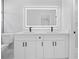 Bathroom featuring a modern vanity with dual sinks and a sleek, illuminated mirror at 3079 Sw 168 Pl, Ocala, FL 34473