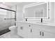 Modern bathroom showcasing double sink vanity and shower with glass enclosure at 3079 Sw 168 Pl, Ocala, FL 34473