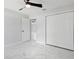 Bright bedroom with closet and marble floors, and an open doorway to another room at 3079 Sw 168 Pl, Ocala, FL 34473
