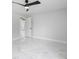 Bright bedroom featuring modern ceiling fan and stylish marble tile flooring at 3079 Sw 168 Pl, Ocala, FL 34473