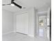Bright bedroom with closet, marble floors, and an open doorway to another room at 3079 Sw 168 Pl, Ocala, FL 34473