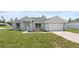Charming one-story home with a well-manicured lawn and attached two-car garage at 3079 Sw 168 Pl, Ocala, FL 34473