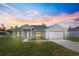 Charming one-story home with a well-manicured lawn and attached two-car garage at 3079 Sw 168 Pl, Ocala, FL 34473