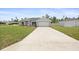 Beautiful new construction with a lush front lawn and a spacious concrete driveway at 3079 Sw 168 Pl, Ocala, FL 34473