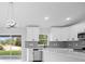 Bright kitchen with stainless steel appliances and a sliding glass door to the back yard at 3079 Sw 168 Pl, Ocala, FL 34473