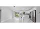 This open kitchen and dining area features stainless steel appliances and marble floors at 3079 Sw 168 Pl, Ocala, FL 34473