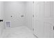 Clean, bright laundry room includes new connections and a tile floor at 3079 Sw 168 Pl, Ocala, FL 34473