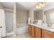 Well-lit bathroom with a shower, tub, and double sink vanity, offering a comfortable space at 3102 Ne 26Th St, Ocala, FL 34470