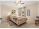 Cozy bedroom featuring a comfortable bed, ceiling fan, and view of the backyard at 3102 Ne 26Th St, Ocala, FL 34470