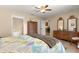 Bright bedroom with access to the Primary bathroom, walk-in closets, and a decorative dresser at 3102 Ne 26Th St, Ocala, FL 34470