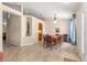 Open-concept dining room with view to the kitchen featuring tile floors and natural light at 3102 Ne 26Th St, Ocala, FL 34470