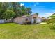 Charming single-story home with a well-manicured lawn and traditional architectural details at 3102 Ne 26Th St, Ocala, FL 34470