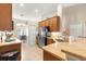 Well-lit kitchen featuring stainless steel appliances, wooden cabinets, and an open layout at 3102 Ne 26Th St, Ocala, FL 34470