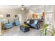 Spacious living room with an open layout, comfortable seating, and a view of the kitchen and dining area at 3102 Ne 26Th St, Ocala, FL 34470