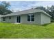 The back of the house has a sliding glass door leading into the backyard at 4105 Se 138Th Pl, Summerfield, FL 34491