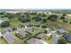 Wide aerial view of a residential neighborhood with manicured lawns and tree coverage at 4360 Sw 62Nd Loop, Ocala, FL 34474