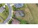Overhead view of a home with a screened-in pool, surrounded by a well-kept lawn and neighborhood streets at 4360 Sw 62Nd Loop, Ocala, FL 34474