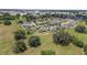 Aerial view of a residential area highlighting neighborhood layout with green spaces, homes and tree coverage at 4360 Sw 62Nd Loop, Ocala, FL 34474