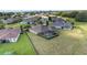 Aerial shot of a backyard with a pool surrounded by a screen enclosure and mature landscaping at 4360 Sw 62Nd Loop, Ocala, FL 34474