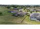Aerial image shows backyard with screened pool, lawn, and fencing; part of a residential community at 4360 Sw 62Nd Loop, Ocala, FL 34474