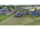 Aerial view of a fenced backyard with a screened-in pool and spacious lawn in a residential area at 4360 Sw 62Nd Loop, Ocala, FL 34474