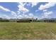 This sprawling backyard provides a lush green space, mature trees, and a screened-in patio, ideal for outdoor living at 4360 Sw 62Nd Loop, Ocala, FL 34474