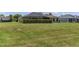 A generously sized backyard features a lush lawn, established trees, and a screened-in patio, perfect for Gathering gatherings at 4360 Sw 62Nd Loop, Ocala, FL 34474