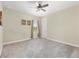 Bedroom with neutral walls, ceiling fan, carpet floors, and a window providing natural light at 4360 Sw 62Nd Loop, Ocala, FL 34474
