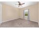 Cozy bedroom with light colored walls, carpet, and natural light from the window at 4360 Sw 62Nd Loop, Ocala, FL 34474