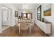 Elegant dining room with stylish furniture, hardwood floors, and modern décor at 4360 Sw 62Nd Loop, Ocala, FL 34474