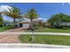 Charming single-story home featuring two palm trees, a well-manicured lawn, and a two car garage at 4360 Sw 62Nd Loop, Ocala, FL 34474